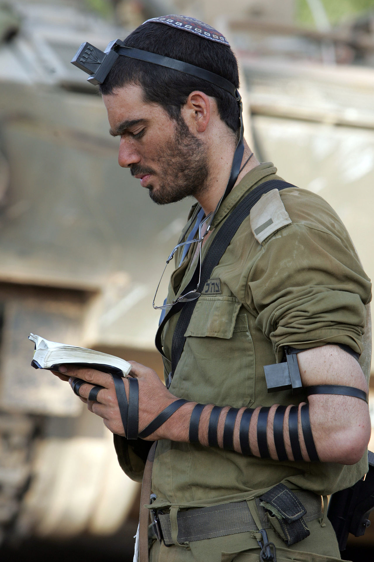 1280px-IDF_soldier_put_on_tefillin.jpg