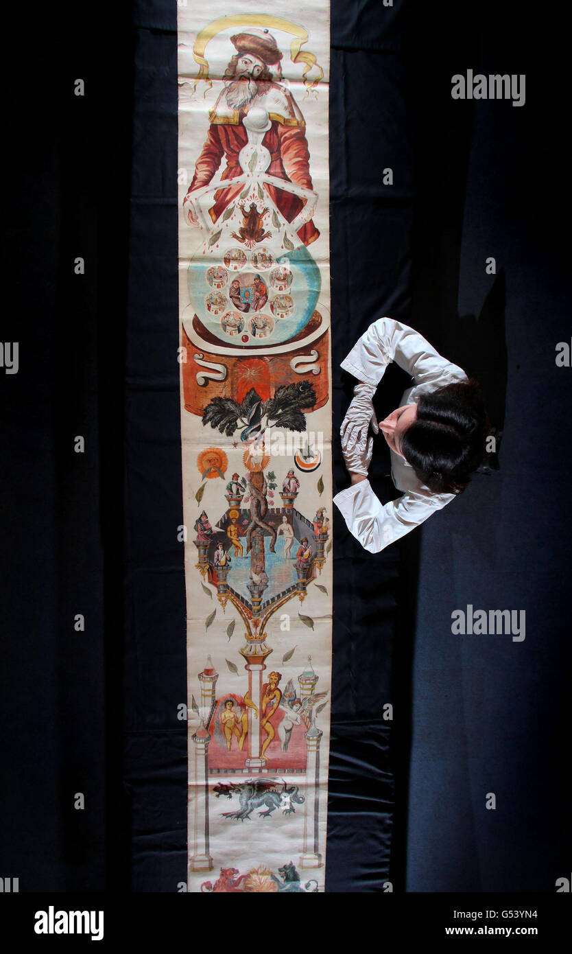 cate-watson-science-museum-library-assistant-inspects-the-ripley-scroll-G53YN4.jpg